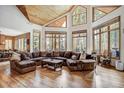 Bright living room with vaulted ceilings, hardwood floors, large windows, and comfortable seating at 47 Forest Cir, Breckenridge, CO 80424