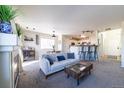 Bright and airy living room with comfy sofas, a fireplace, and large windows at 1214 S Zeno Way # D, Aurora, CO 80017