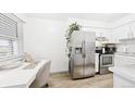 Bright kitchen featuring stainless steel appliances and a dedicated workspace at 677 Vrain St # 15, Denver, CO 80204