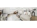 Bright living room with comfortable seating and bar overlooking the kitchen at 677 Vrain St # 15, Denver, CO 80204