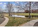 Scenic community view with pond, golf course, and mature trees at 2824 W Centennial Dr # L, Littleton, CO 80123