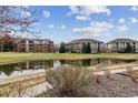 Picturesque community view with pond, walking path, and well-maintained landscaping at 2824 W Centennial Dr # L, Littleton, CO 80123