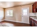 The kitchen includes a small pantry area with access to the outside at 261 Linda Ln, Denver, CO 80221