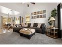 Comfortable living room showcases vaulted ceilings, modern decor, and an open layout perfect for entertaining at 4713 Perth St, Denver, CO 80249