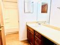 Bright bathroom with vanity, sink, and a bathtub with shower at 14720 E Kentucky Dr # 611, Aurora, CO 80012