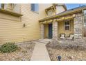 Stone columns and a walkway leading to the front door at 3999 Blue Pine Cir, Highlands Ranch, CO 80126