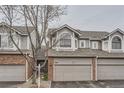 Beautiful exterior featuring a brick and siding facade, attached garage, and well-kept surroundings at 7580 S Monaco Way, Centennial, CO 80112