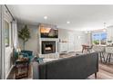 Inviting living room featuring a fireplace and modern furnishings, perfect for relaxation at 13542 Achilles Dr, Lone Tree, CO 80124