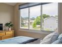 Cozy bedroom featuring natural light and neighborhood views, creating a serene and inviting atmosphere at 6534 S Union Way, Littleton, CO 80127