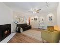 Inviting living space with a fireplace, ceiling fan, and contemporary decor at 534 E 7Th Ave # 101, Denver, CO 80203