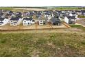 Wide aerial view of a neighborhood showcasing a variety of homes and green spaces at 39713 Penn Rd, Elizabeth, CO 80107