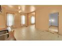 Open living room layout with large windows and tile flooring, offering ample natural light at 1930 E Martin Luther King Jr Blvd, Denver, CO 80205