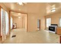 Spacious living room with tile floors, a ceiling fan, and a vintage stove and oven at 1930 E Martin Luther King Jr Blvd, Denver, CO 80205