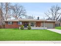 Charming brick ranch home with a well-manicured lawn and inviting curb appeal at 3560 S Glencoe St, Denver, CO 80237