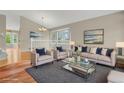 Bright living room with a comfortable seating area and a large window for natural light at 21684 Swale Ave, Parker, CO 80138