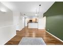 Spacious living area with hardwood floors and open access to the kitchen is perfect for entertaining friends and Gathering at 1703 Whitehall Dr # 5I, Longmont, CO 80504