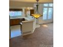 Bright kitchen featuring ample counter space and a cozy breakfast bar at 10129 Grove Ct # B, Westminster, CO 80031
