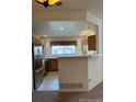 Bright kitchen with modern appliances, wood cabinets, and a convenient breakfast bar area at 10129 Grove Ct # B, Westminster, CO 80031