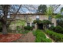 Charming two-story brick home with mature landscaping in a serene, tree-lined neighborhood at 4070 S Hudson Way, Englewood, CO 80113