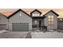 Charming two-story home featuring a mix of siding and stone accents and a cozy front porch at 5622 Shadescale Way, Castle Rock, CO 80104