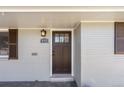 Close-up of the front door showcasing its design and the home's welcoming entrance at 495 S Olive Way, Denver, CO 80224