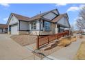 A well-kept single-Gathering residence featuring an attached garage and accessible ramp at 7501 S Addison Way, Aurora, CO 80016