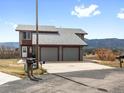 Charming two-story home with two-car garage and mountain views under a blue sky at 760 Century Pl # A, Monument, CO 80132