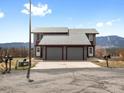 Charming two-story home with two-car garage and mountain views under a blue sky at 760 Century Pl # A, Monument, CO 80132