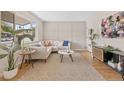 Comfortable living room with stylish decor, large windows, and ample space for relaxation at 1205 W 101St Ave, Northglenn, CO 80260