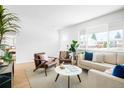 Cozy living room featuring hardwood floors, modern furniture and lots of natural light at 1205 W 101St Ave, Northglenn, CO 80260