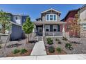 Charming home with covered porch and stylish landscaping at 8049 Monte Vista Cir, Littleton, CO 80125