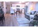 Cozy living room and kitchen combo, featuring stylish furniture and modern appliances at 650 S Clinton St # 2A, Denver, CO 80247