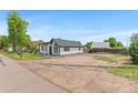 Beautiful modern home with ample parking space and well-maintained gravel yard at 1100 Urban St, Lakewood, CO 80401