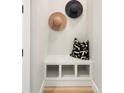 Entryway with hats on the wall, neutral colors, and a built-in bench at 8240 E 36Th Ave # 33, Denver, CO 80238