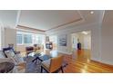 Bright and airy living room with large windows, hardwood floors, and stylish furnishings at 1891 Curtis St # 1613, Denver, CO 80202