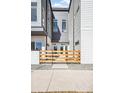 Modern townhomes featuring wood fencing and front door entrances, showcasing curb appeal at 5375 W 14Th Ave, Lakewood, CO 80214