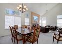 A large living room with a beautiful fireplace and plenty of natural light from big windows at 2608 S Troy Ct, Aurora, CO 80014
