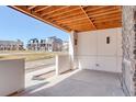 Covered patio offers an outdoor living space with views of the surrounding community at 1778 Peak Loop, Broomfield, CO 80023
