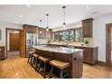 Spacious kitchen with a large center island, stainless steel appliances, and beautiful cabinetry at 2023 Mammoth Ct, Evergreen, CO 80439