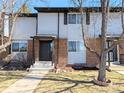 Charming townhome exterior featuring a well-maintained lawn and an inviting front entrance at 3061 W 92Nd Ave # 2D, Westminster, CO 80031