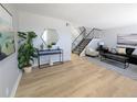 Stylish living room boasts wood floors and neutral tones at 3061 W 92Nd Ave # 2D, Westminster, CO 80031