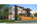Modern home featuring clean lines, large windows, and a fenced yard, showcasing contemporary design at 1601 S Columbine St, Denver, CO 80210