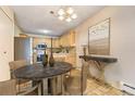 Charming dining area with a round table and stylish decor at 6940 E Girard Ave # 203, Denver, CO 80224