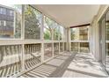 Bright sunroom with windows offering scenic views at 6940 E Girard Ave # 203, Denver, CO 80224