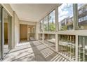 Sunroom with ample natural light and access to the outdoors at 6940 E Girard Ave # 203, Denver, CO 80224