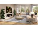 Bright living room with modern fireplace, large windows, and comfortable seating area at 1929 Grayside Cir, Castle Rock, CO 80109
