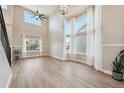 Bright living room with hardwood floors, high ceilings, and plenty of natural light at 15008 Clayton St, Thornton, CO 80602