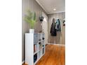 Bright entryway with built-in shelving and hardwood floors at 2610 S Vine St, Denver, CO 80210