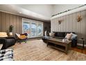 Spacious living room featuring a cozy fireplace and large windows at 2610 S Vine St, Denver, CO 80210