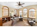 Bright home office with natural light, arched windows, and a modern desk at 566 Monroe St, Denver, CO 80206